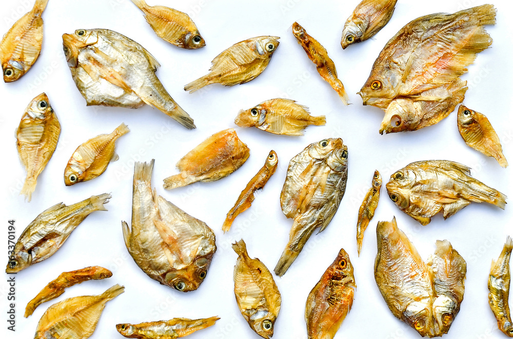 Stockfoto Small dry fish from the sun on the white background