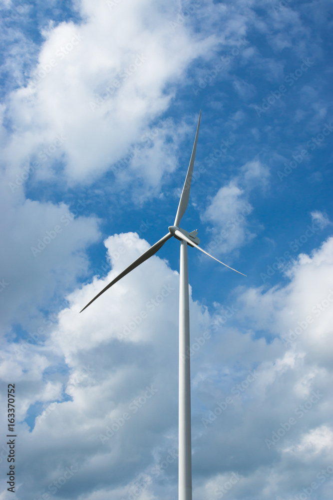Wind turbine with cloud background on the sky. Wind turbine with cloud background on the sky.
