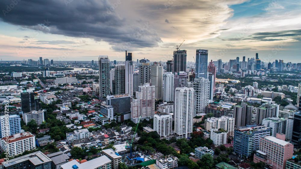 Fototapeta premium Aerial drone view of Bangkok during beautiful cloudy sunset