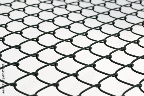 Metal mesh wire fence closeup.