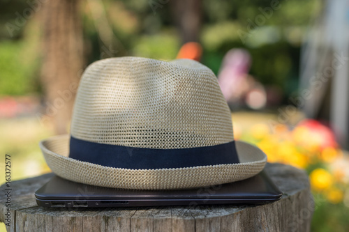 hat on top of laptop