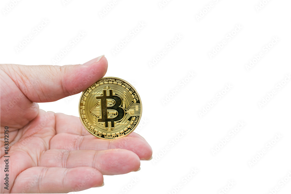 Hand holding a golden Bitcoin isolated on white background with copy space and clipping path.