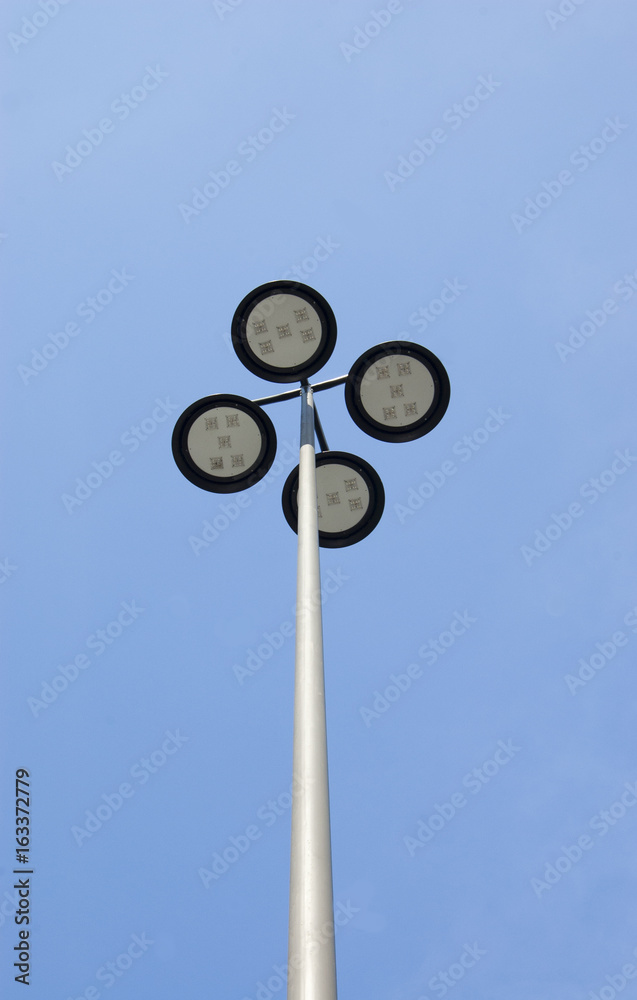 Outdoor or Street Light Fixture and Pole on Blue Sky Background Outdoor or Street Light Fixture and Pole on Blue Sky Background