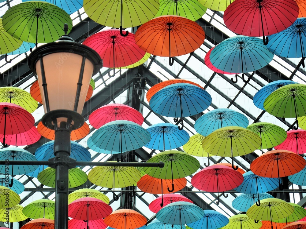 Colorful umbrellas hanging from the ceiling