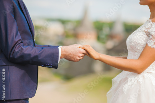 wedding couple holding hands, love © sharshonm