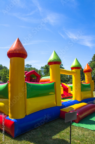 Obraz na płótnie Inflatable big colofrull castle for kids in playground w salonie
