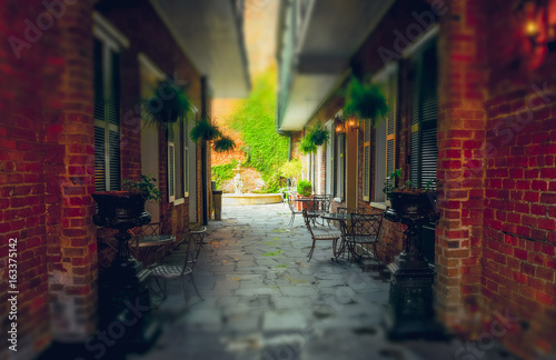 Fototapeta Naklejka Na Ścianę i Meble -  Ancient romantic cafe on the street in New Orleans