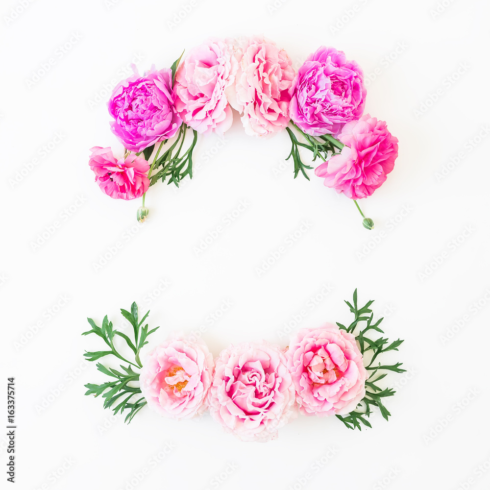 Wreath flower frame of pink roses and leaves on white background. Flat lay, top view