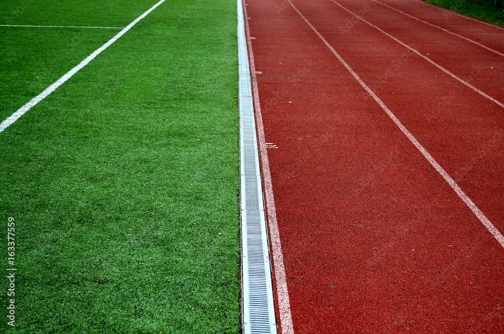 treadmills at the stadium, direct and grass, closeup, background