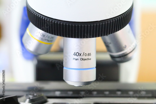 Scientist hands with microscope, examining samples and liquid. Medical research with technical equipment, Close-up of scientist hands with microscope.