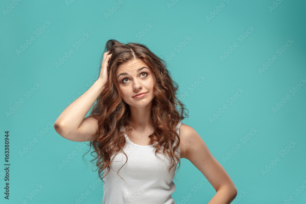Portrait of young woman with shocked facial expression Portrait of young woman with shocked facial expression