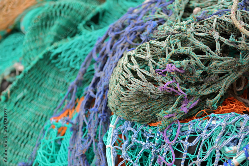 Close-up on colorful fishing nets in the Portree fishing harbor, Isle of Skye, Highlands, Scotland, UK Close-up on colorful fishing nets in the Portree fishing harbor, Isle of Skye, Highlands, Scotland, UK