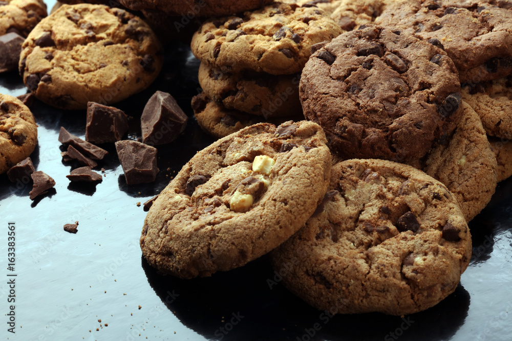 Fototapeta premium Chocolate cookies on marble table. Chocolate chip cookies shot