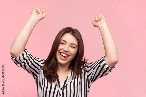 Woman posing with hands up