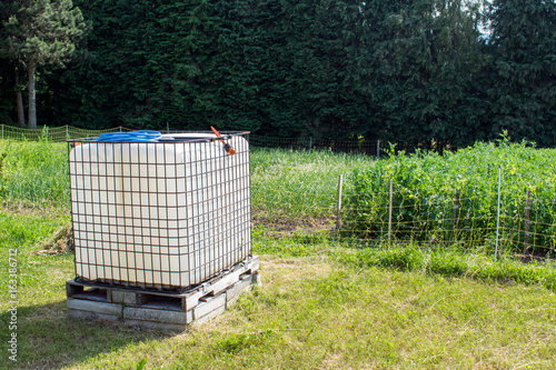 Obraz na plátne Square plastic water tank in the garden