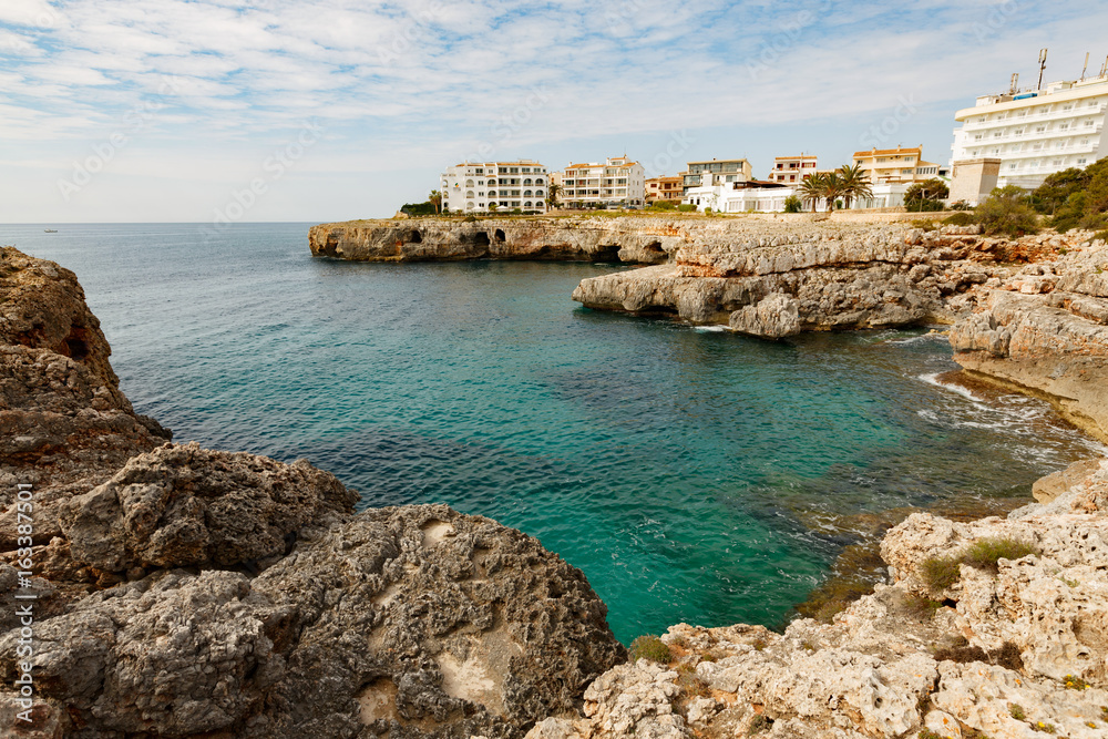 Rocky coast and blue lagoon on the island of Mallorca, Spain