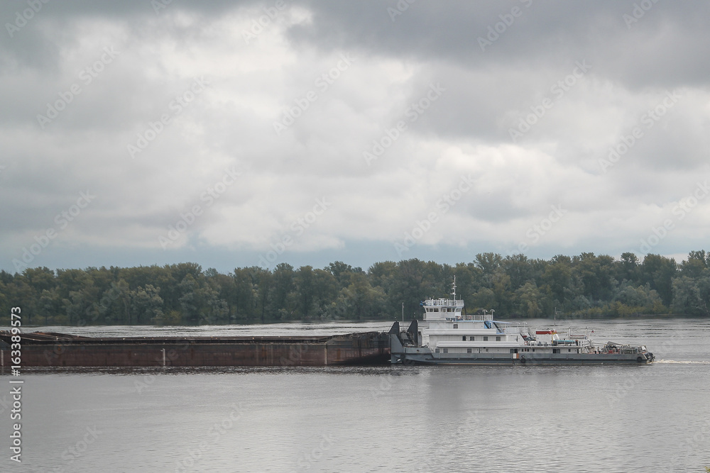 Cargo ship sailing on a volga river