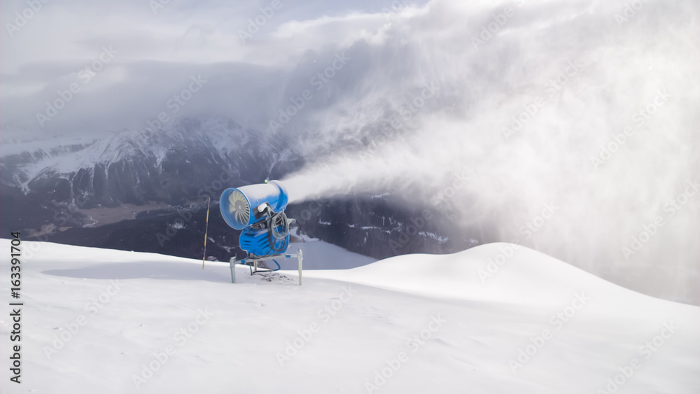 Cannon shoots snow in the Swiss Alps tourist area