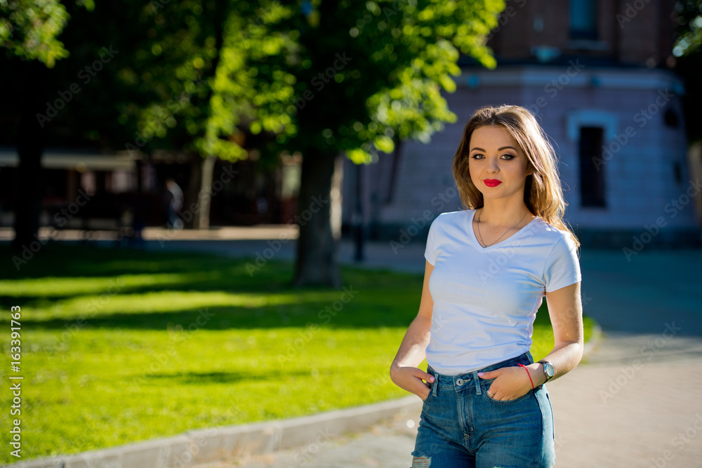Portrait of a young, attractive girl in the city. Close-up. Portrait of a young, attractive girl in the city. Close-up.