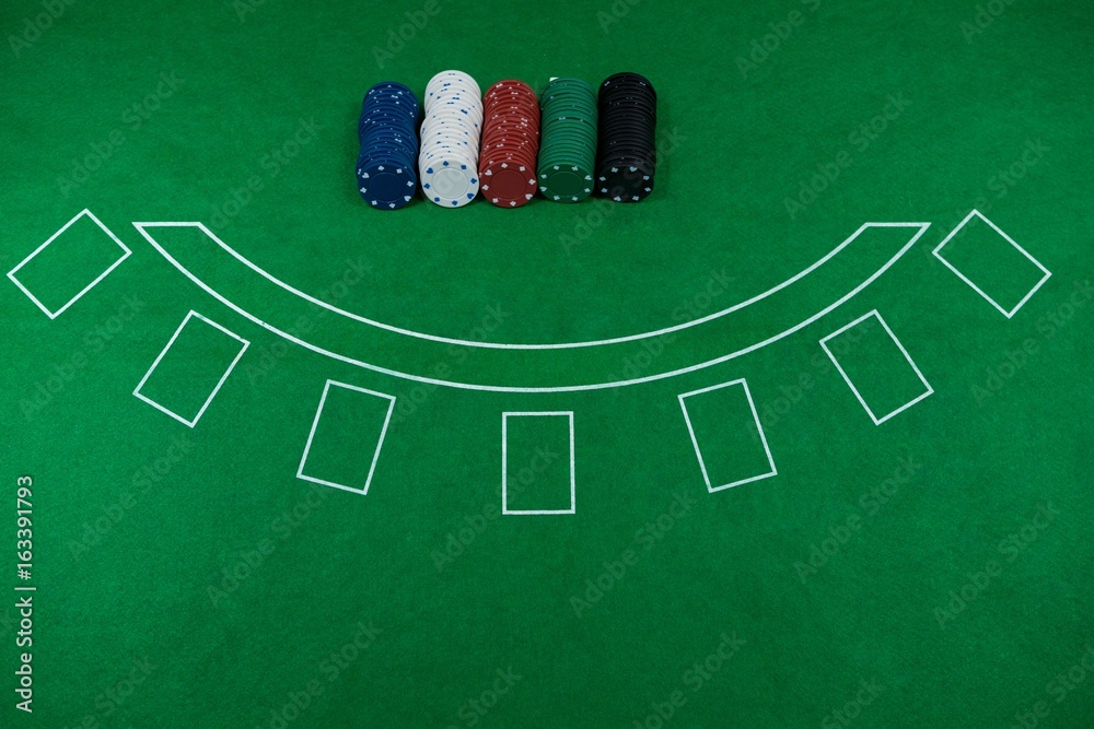 Fototapeta premium High angle view of chips on blackjack table