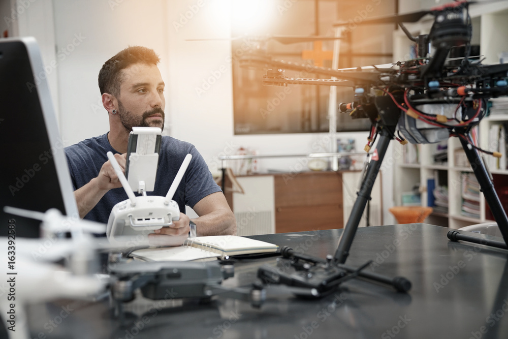 Fototapeta premium Engineer working on drone in office