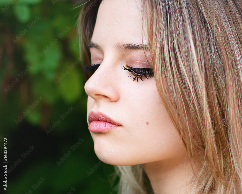 Portrait a beautiful girl with the lowered look Portrait a beautiful girl with the lowered look