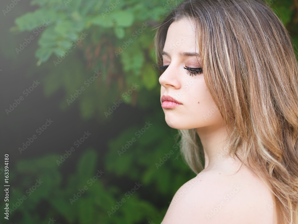 Portrait a beautiful girl with the lowered look Portrait a beautiful girl with the lowered look
