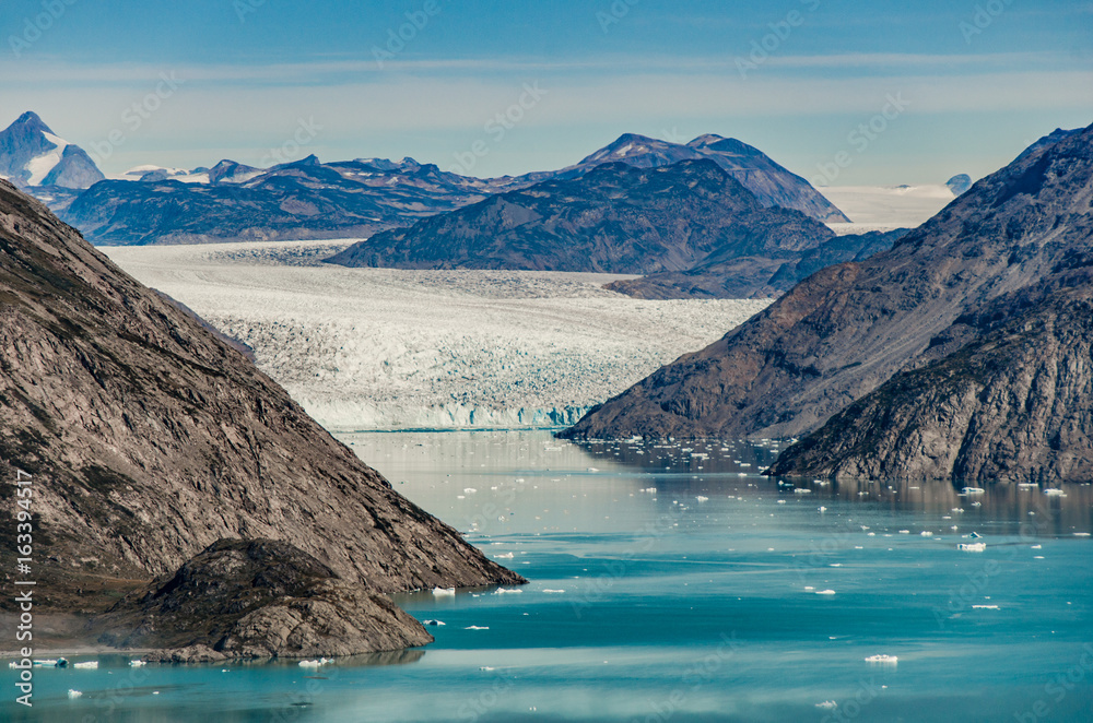 Naklejka premium Small icebergs and reflections near a glacier