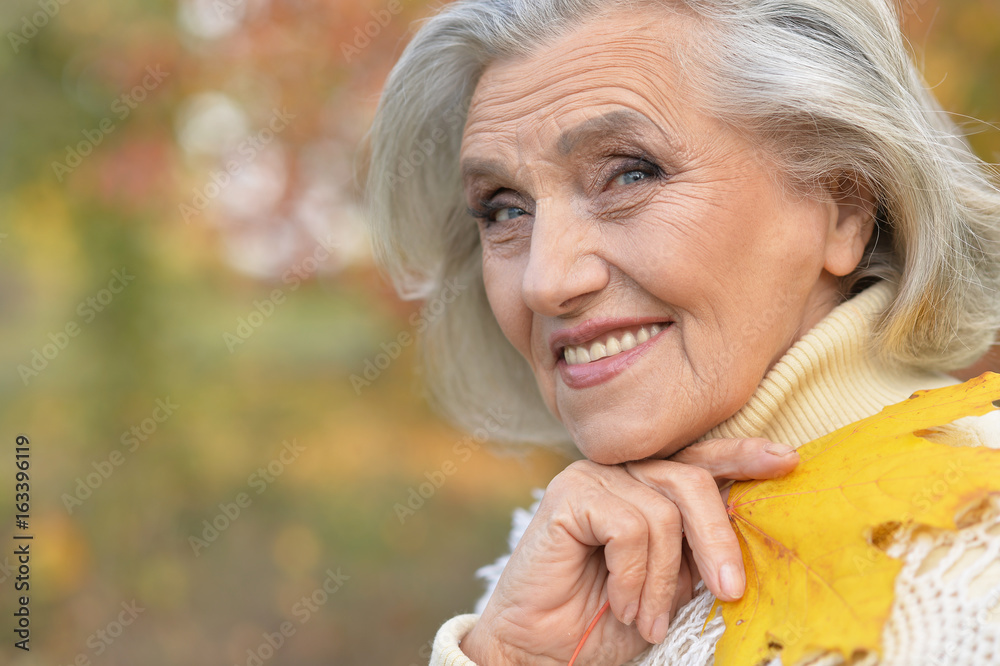 woman holding leaf and berries woman holding leaf and berries