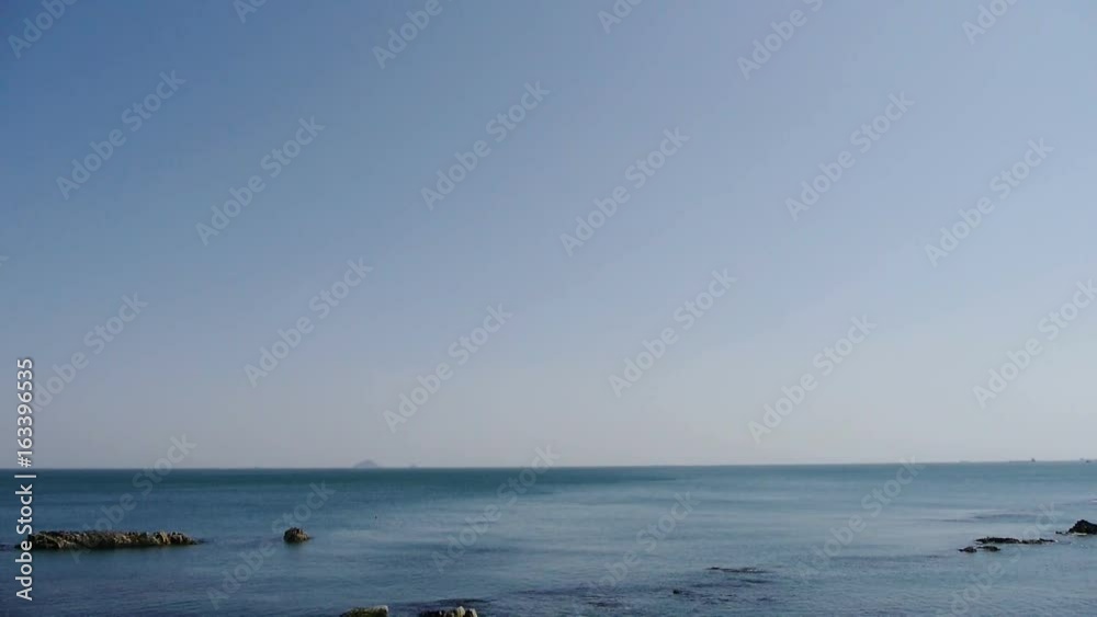 Ocean water surface and rock reef coastal,algae,seaweed,ebb,horizon,skyline. Ocean water surface and rock reef coastal,algae,seaweed,ebb,horizon,skyline.