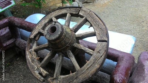 old wheel,steering wheel, and wood seat,car  photo