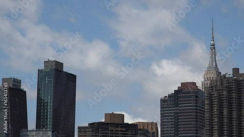 Viewing beautiful breathtaking Manhattan Skyline from Long Island City in New York, wide shot panorama with ONU,United Nations Headquarters,Ultra Hd 4k, real time