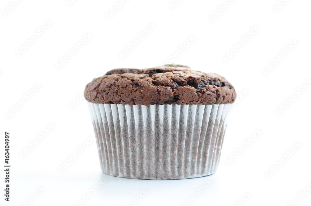 One chocolate muffin on white background. Picture for a menu or a confectionery catalog. One chocolate muffin on white background. Picture for a menu or a confectionery catalog.