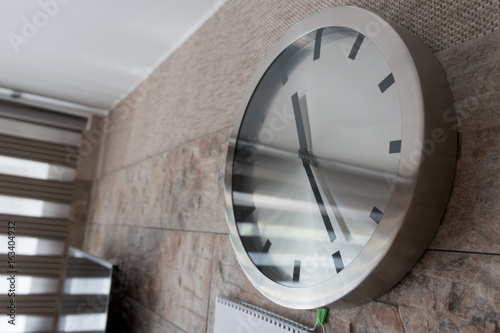 clock hangs on the wall in the room