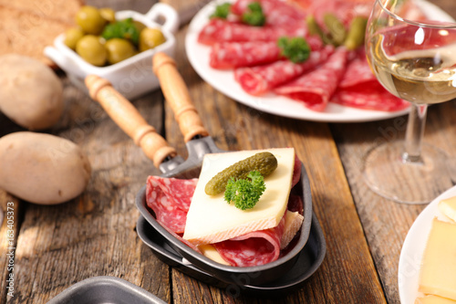 raclette cheese with charcuterie