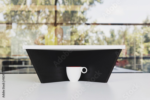 Fotografie Hidden cup of water on white table