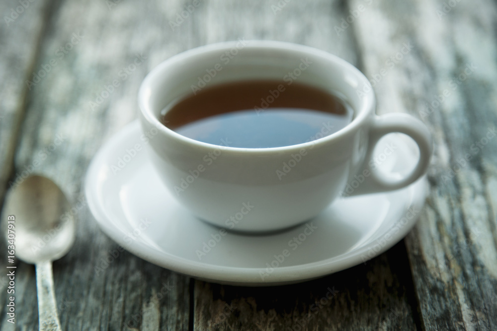 Close up of  cup of tea on a vintage wooden background (Taste, thirst, drink concept)