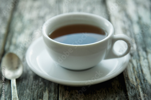 Close up of cup of tea on a vintage wooden background (Taste, thirst, drink concept)