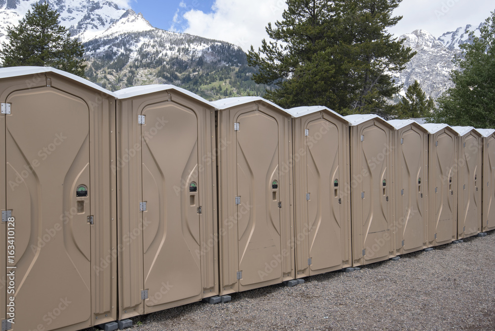 Naklejka premium Row of portable toilets