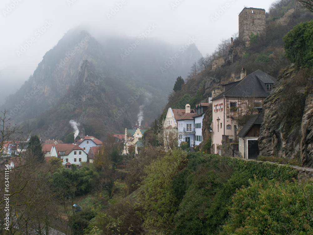 Traditional houses during a foggy winter day in the village of Durnstein, Austria