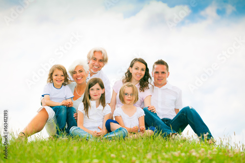 Big Family Standing At The Top Of A Hill