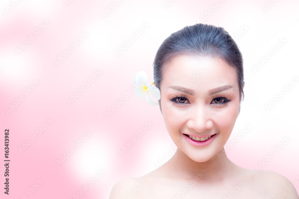 Beauty Woman face Portrait. Beautiful Spa model Girl with Perfect Fresh Clean Skin. female looking at camera and smiling. Youth and Skin Care Concept. Isolated on a pink background Beauty Woman face Portrait. Beautiful Spa model Girl with Perfect Fresh Clean Skin. female looking at camera and smiling. Youth and Skin Care Concept. Isolated on a pink background