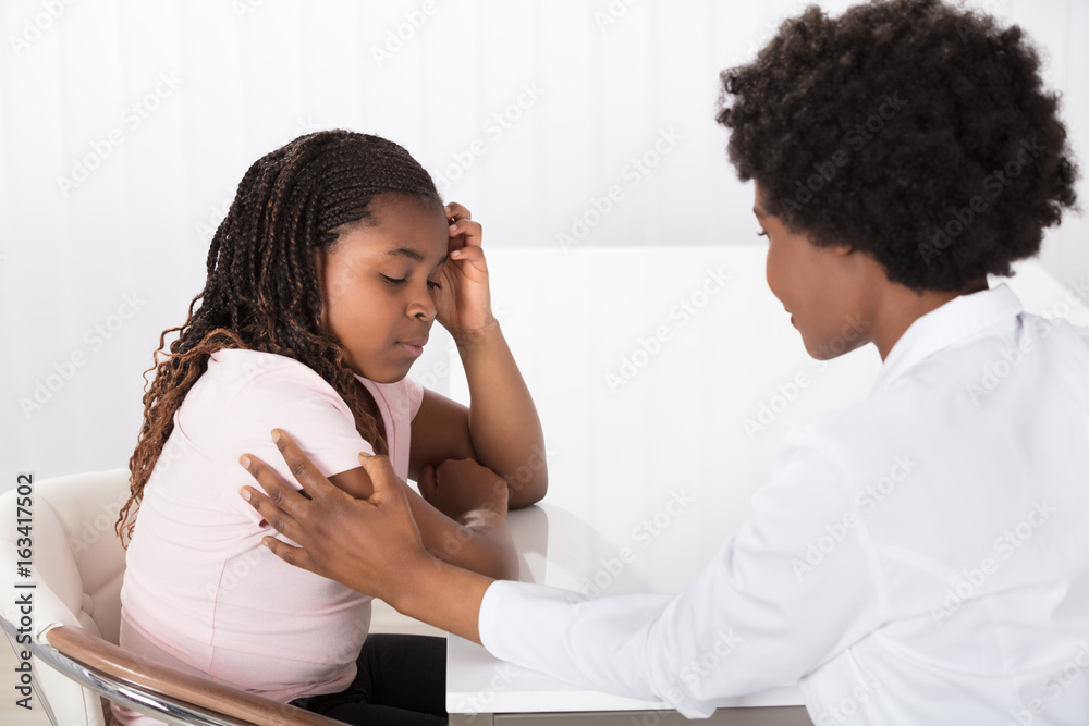 Female Doctor Comforting Depressed Patient Female Doctor Comforting Depressed Patient