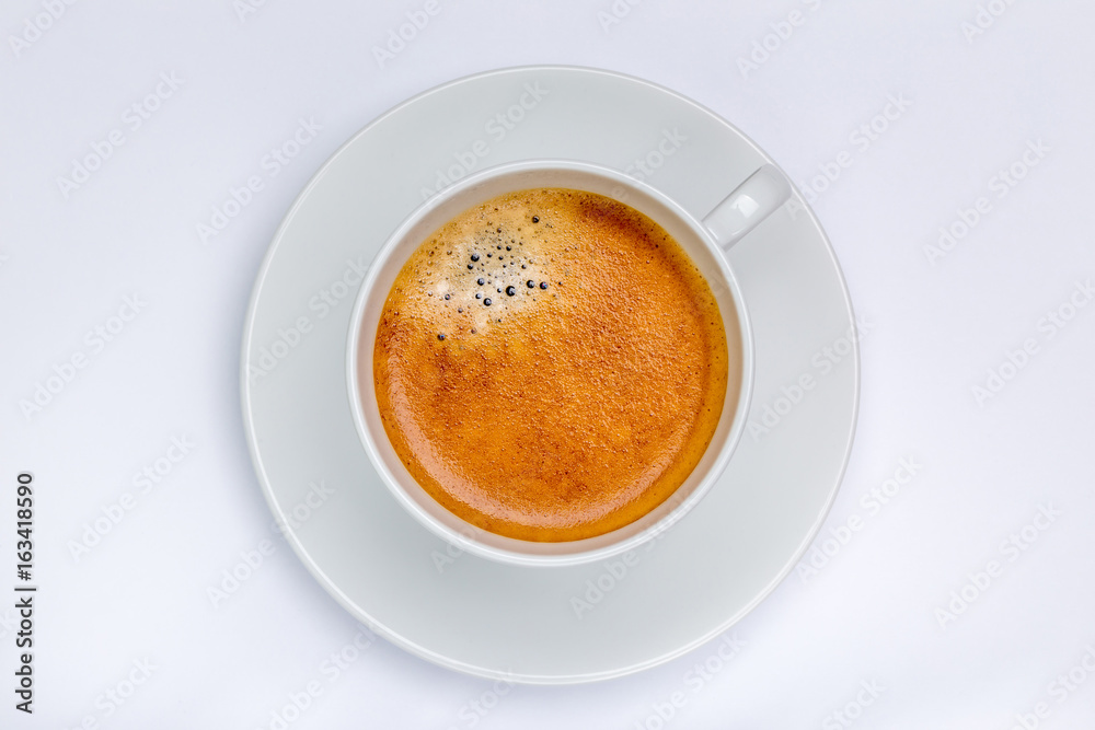Hot black coffee with foam bubbles in white cup with white background, morning coffee concept. Hot black coffee with foam bubbles in white cup with white background, morning coffee concept.
