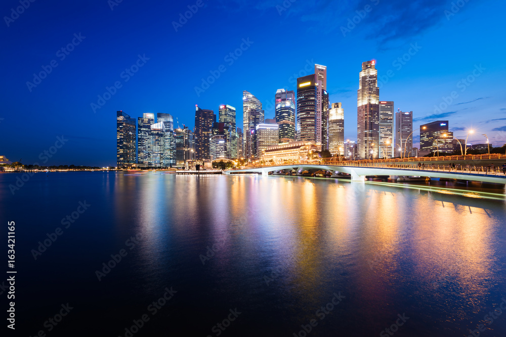 Singapore skyline at night. Central Business District, Fullerton Park at the newly built Jubilee Bridge.
