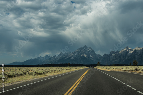 Highway to stormy mountains