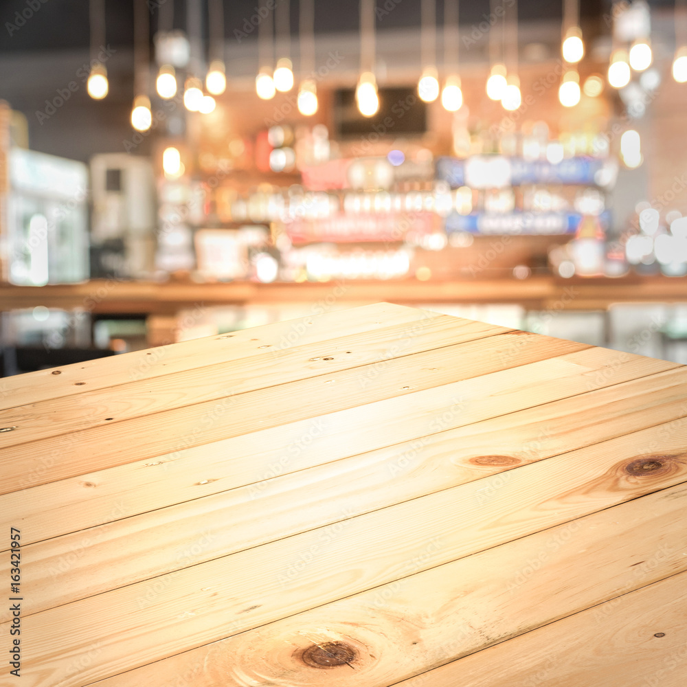 Empty wood top table with space for display product in Blurred cafe background. Empty wood top table with space for display product in Blurred cafe background.