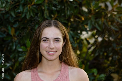 Happy young woman in the yard