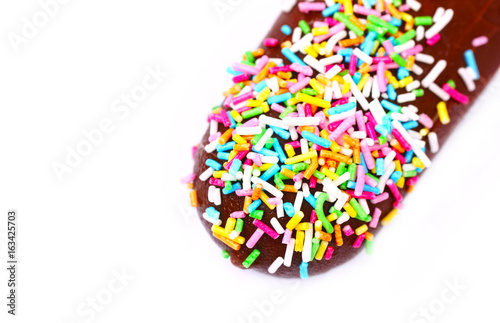 ice cream with chocolate, colored sugar sprinkles, macro