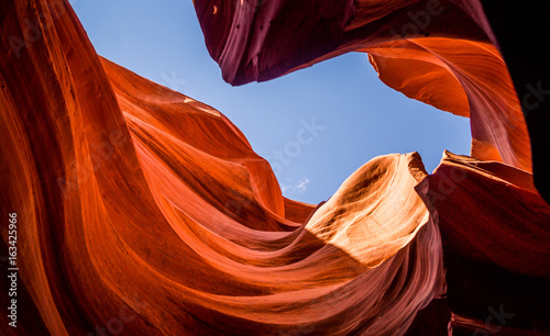 picturesque underground cave. Lower Canyon Antelope and blue sky